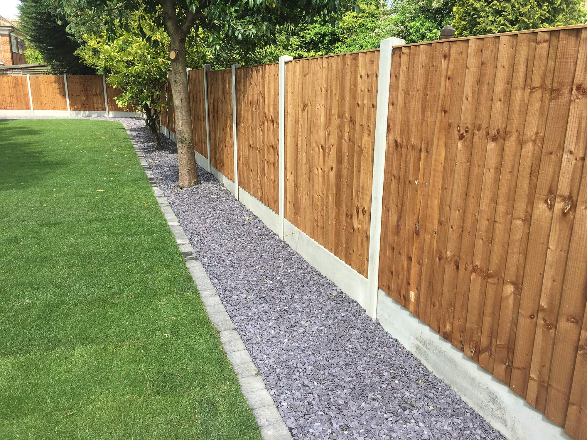 An image of closeboard fence panels in rear garden